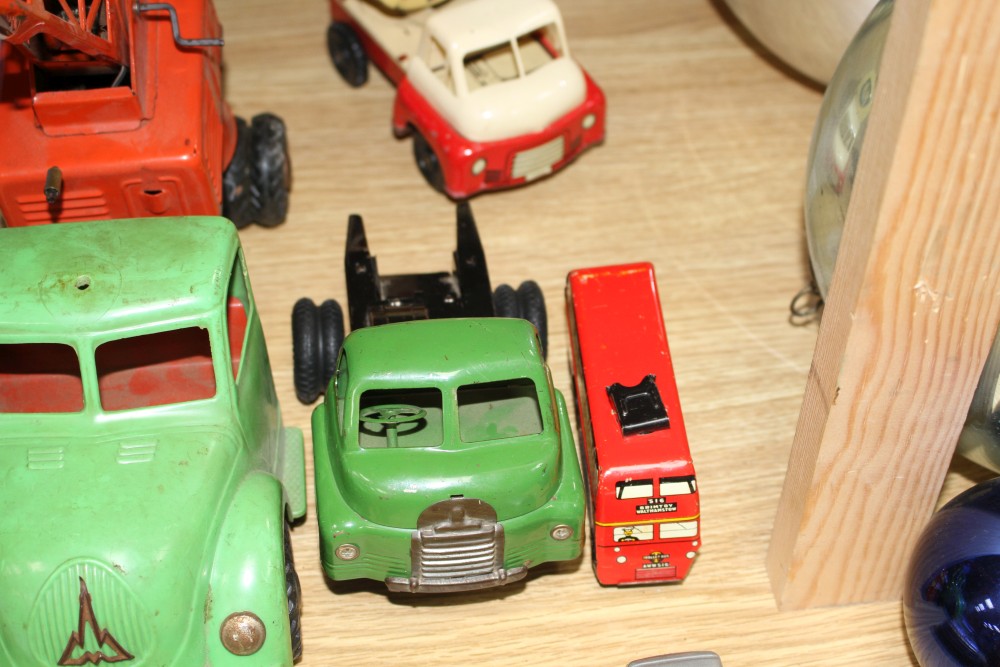 A group of assorted tinplate and diecast toys